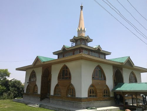Baba Reshi Shrine Persian style architecture surrounded by green meadows in Gulmarg Kashmir