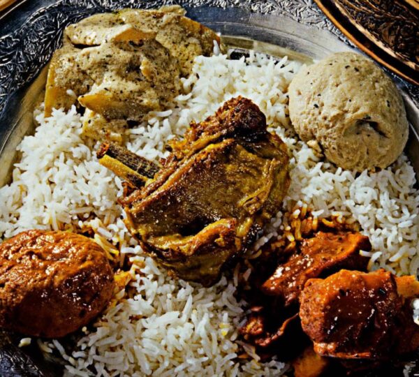 Kashmiri Wazwan trami platter with fragrant Basmati rice and traditional dishes