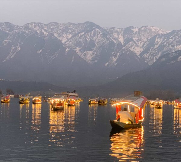Traditional cedarwood houseboat on Dal Lake with hand carved interiors and mountain views