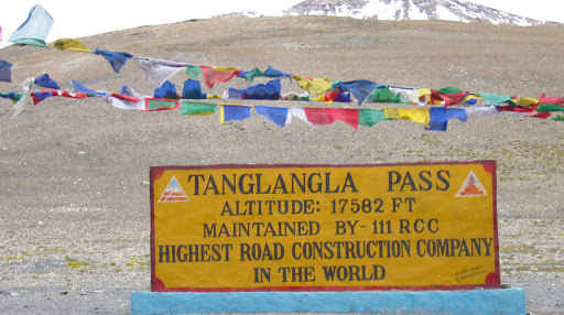 Vast barren mountains at Tanglang La pass with rugged high-altitude terrain under clear skies