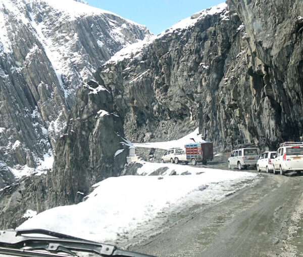 Snow covered mountain pass connecting lush Kashmir valley to stark Ladakh landscape on National Highway 1